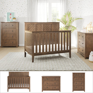 A nursery with the Child Craft Atwood 3-Piece Nursery Set, featuring a crib, dresser, and chest, pairs wooden furniture with light walls, patterned wallpaper, a large window with white curtains, and cozy decorative accents.