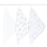Three aden + anais organic cotton muslin oversized washcloths hang on a white rod, each boasting unique pastel patterns: one with small stars, another with hot air balloons, and the last with planets and clouds, all set against a simple white background.