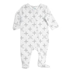 Aden + anais long sleeve zip one-piece is made from breathable cotton muslin with a front zipper and safety cover. It features enclosed feet, black snowflake-like patterns, the word LOVE, and provides cozy comfort.