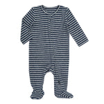 The aden + anais snuggle knit™ newborn footie is a super soft, dark blue onesie with white stripes and long sleeves. It combines comfort and style with snuggle knit footies and a front zipper for easy diaper changes.