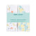 The aden + anais essentials cotton muslin hooded towels 2 pack is packaged in a clear wrap with a light blue label, featuring charming animal and fruit prints. Each super absorbent towel is plush and neatly folded.