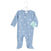 Light blue comfort knit™ footie by aden + anais features white moon patterns, a front zipper with safety cover, and a footed design. Made from cotton-rich fabric for added coziness, it hangs on a white hanger with a tag showing the brand and size.