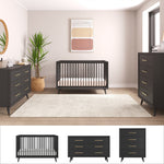 A mid-century modern nursery featuring the Child Craft Cranbrook 3 Piece Nursery Set with crib, dresser, and chest, accented by gold handles, a large white rug, potted plant, and soft abstract wall art.