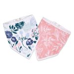 The aden + anais essentials cotton muslin bandana bibs 2 pack includes two triangular bibs with adjustable snap closures: one with a blue/green floral design on white, the other featuring a white floral pattern on pink.