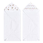 Two aden + anais essentials cotton muslin hooded towels are laid flat, each featuring super absorbent cotton terry with a hood corner lined in light-colored strips showcasing small animal illustrations like elephants and lions on a pristine white background.