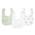 The essentials cotton muslin snap bibs 3 pack by aden + anais offers style and practicality with three absorbent bibs: green with a forest animal pattern, white with light animal sketches, and white with beige leaf designs. Designed to grow with your baby.