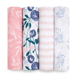 The aden + anais essentials cotton muslin swaddle blanket 4 pack features four rolled designs: pink with a bird and leaf pattern, white with purple flowers, white with pink dot stripes, and white with blue leaves. Crafted from soft cotton muslin, they provide breathable comfort for your baby.