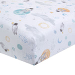 The aden + anais essentials cotton muslin crib sheet offers a playful space theme with astronauts, planets, and stars in light blue, yellow, orange, and gray. Made from soft, breathable cotton muslin, its perfect for a child-friendly atmosphere.