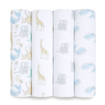 The aden + anais essentials cotton muslin swaddle blanket 4 pack features four rolled-up swaddles with animal prints: blue whales, gray elephants, yellow giraffes, and a pastel ocean mix on a crisp white background. Made from breathable cotton, these are versatile baby essentials.