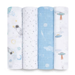 The aden + anais essentials cotton muslin swaddle blanket 4 pack features breathable blankets with playful space-themed designs, including astronauts, stars, clouds in a blue sky, and UFOs. The soft color palette combines white, light blue, and gentle pops of color.