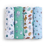 This set includes four Disney™ essentials swaddles by aden + anais, crafted from soft cotton muslin, featuring playful designs of cartoon characters, spaceships, stars, and cacti in vibrant shades of white, green, and blue.