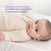 A baby lies on their back wearing a HALO Easy Transition SleepSack TOG 1.5, a quilted long-sleeved wearable blanket designed to help with the swaddle transition and better sleep.