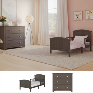 A cozy toddler bedroom featuring the Child Craft Hampton Toddler Bed 2-Piece Set, which includes a gray toddler bed and matching nursery dresser, complemented by pink bedding, a floor lamp, animal wall art, white curtains, and a soft rug on light wood floors. Inset highlights the Hampton toddler bed and nursery dresser from the set.