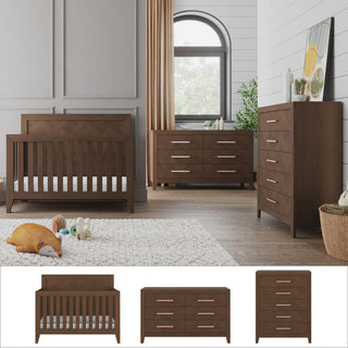 A modern nursery featuring the Child Craft Kieran 3 Piece Nursery Set, which includes a wooden convertible crib, dresser, and chest of drawers—all in matching brown wood with charming pink handles. Soft toys and a cozy rug adorn the floor, while a large window fills the room with natural light.