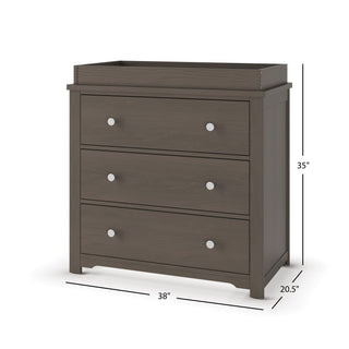 The Child Craft London 2-Piece Nursery Set features a dark wood three-drawer dresser with round silver knobs and raised edge, perfect for your nursery or as a changing table. Dimensions: 38" W x 20.5" D x 35" H.