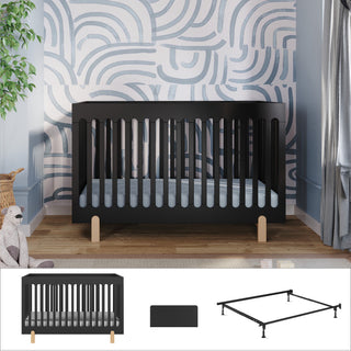 The Child Craft Park Heights 3-Piece Nursery Set with Conversion Kit features a modern black 4-in-1 convertible crib with light wood legs, ideal for mid-century nursery lovers and showcased in a room with blue and white abstract wall art.