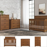 A modern nursery features the Child Craft Redmond 3-Piece Nursery Set with a 4-in-1 convertible crib and toddler guard rail, plus a gray rug, white curtains, brick accent wall, and framed artwork above the crib.