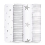 Four rolled-up aden + anais Essentials Cotton Muslin Swaddle Blankets are displayed vertically. The designs from left to right include gray polka dots, horizontal stripes, stars, and close-set lines on a crisp white background, offering timeless elegance and softness.