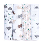 The aden + anais essentials cotton muslin swaddle blanket 4 pack features breathable cotton muslin with patterns of pine trees, mountains, animals, zigzags, and geometric shapes in gray, green, and beige on a white backdrop.