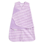 The HALO Swaddle Micro-Fleece TOG 3.0 in purple showcases heart designs, a zip closure, and adjustable wings for comfort and healthy hip development.