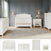 A nursery with gray paneled walls is furnished with the Child Craft Westgate 4-Piece Nursery Set, which includes a 4-in-1 Convertible Crib, dresser, chest, and nightstand all arranged on a light rug. Soft lighting and a vase of flowers create a cozy atmosphere in the baby’s room. Individual pieces from the Child Craft nursery set are displayed below.